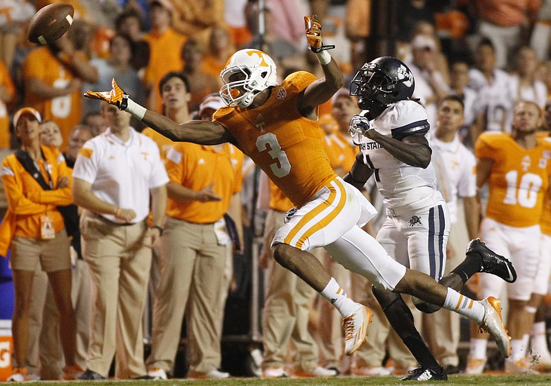 A pass goes over Tennessee wide receiver Josh Malone during the Utah State game.