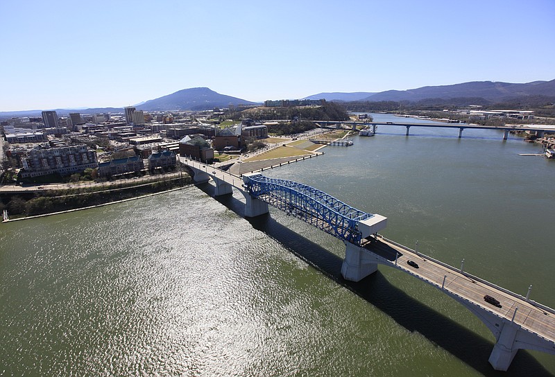 Aerial shows downtown Chattanooga, the Aquarium, Market Street Bridge, Tennessee River and the Bluff View district.