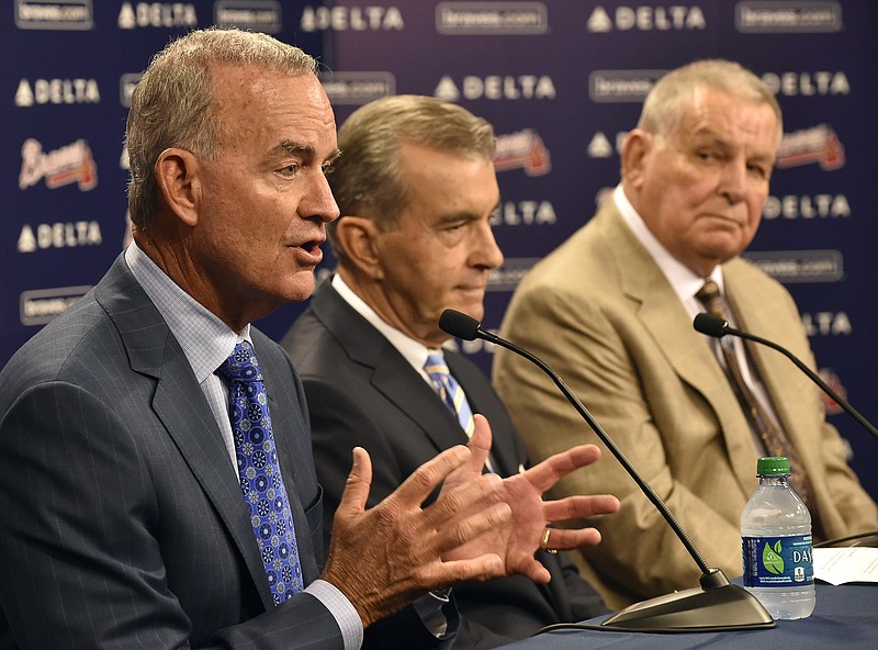 
              Atlanta Braves interim general manager John Hart, left, answers questions with team president John Schuerholz and former manager Bobby Cox, right, after the baseball team fired general manager Frank Wren following a mid-summer collapse that caused the franchise to miss the playoffs, Monday, Sept. 22, 2014, in Atlanta. (AP Photo/David Tulis)
            
