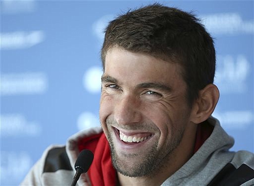 In this Aug. 20, 2014, file photo, U.S. swimmer Michael Phelps laughs during a news conference ahead of the Pan Pacific swimming championships in Gold Coast, Australia.