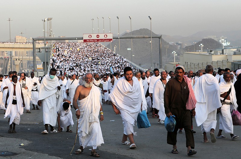 
              Thousands of Muslim pilgrims make their way to throw stones at a pillar, symbolizing the stoning of Satan in a ritual called "Jamarat," the last rite of the annual hajj, in the Mina neighborhood of Mecca, Saturday, Oct. 4, 2014. The 10th day of the Islamic lunar month of Dhul-Hijja, during the hajj, is the beginning of Eid al-Adha, the most important Islamic holiday, to mark the willingness of the prophet Ibrahim, or Abraham to Christians and Jews, to sacrifice his son. (AP Photo/Khalid Mohammed)
            