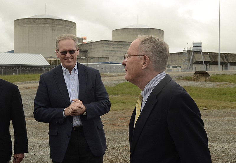 Bill Johnson, left, president and CEO of TVA, greets U. S. Senator Lamar Alexander as he arrives at the Watts Bar Nuclear Plant on Wednesday, Oct 8, 2014, near Spring City, Tenn. Alexander was visiting the newly-constructed Flex building, designed to protect emergency equipment in the event of a disaster.