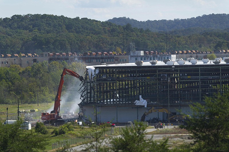 Demolition of the 750,000-square-foot K-31 Building is underway Wednesday, Oct. 8, 2014, at Oak Ridge's East Tennessee Technology Park. K-31 is the fourth of five gaseous diffusion buildings to be removed at the former uranium enrichment site. The clean up contractor, UCOR, plans to start demolishing the last enrichment plant, K-27, next year.