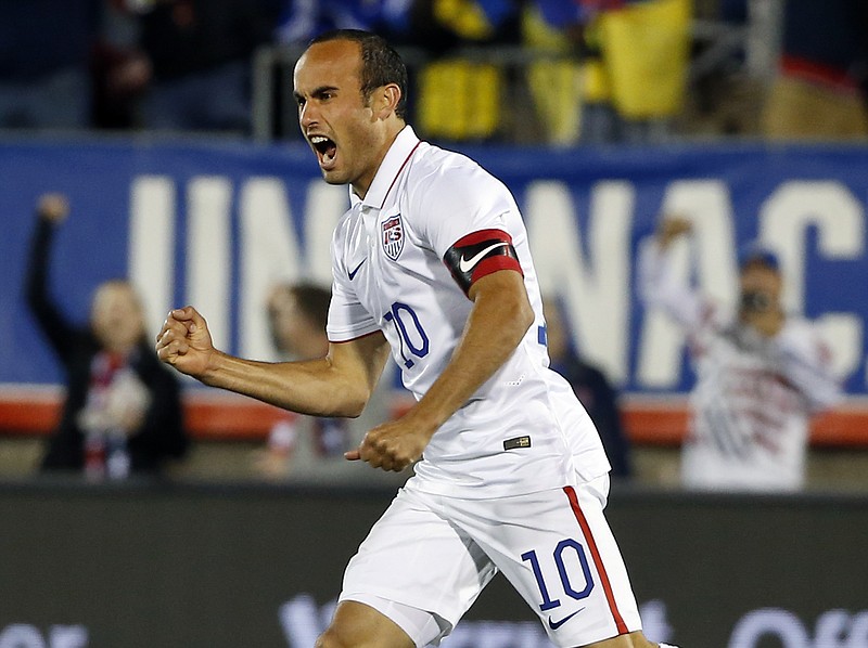 
              United States' Landon Donovan celebrates his teammate Mix Diskerud's goal in the first half of an exhibition soccer match against Ecuador in East Hartford, Conn., Friday, Oct. 10, 2014. Donovan was making his last international soccer appearance. (AP Photo/Elise Amendola)
            