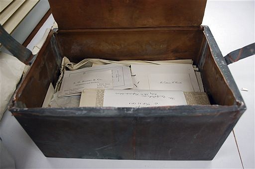 Items are seen  inside a shoebox-sized 1901 time capsule in Boston in this Oct. 15, 2014,  Bostonian Society, photo.