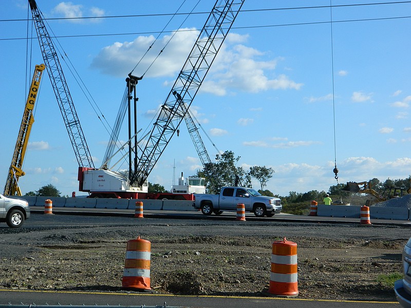 Crews pour gravel as part of renovation work to exit 20 at Interstate 75 in Cleveland, Tenn. The improvements to the interchange, which are scheduled to be completed by November 2015, coincide with efforts to develop infrastructure for a proposed industrial park to be located on the east side of the interstate.