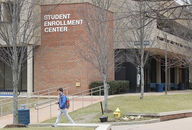 A student walks past the student enrollment center at Chattanooga State Technical Community College in this Feb. 5, 2014, photo.