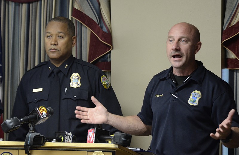 Chattanooga Police Department Lt. Todd Royval, right, speaks as Assistant Chief Tracy Arnold listens during a press conference Monday at the Police Services Center.