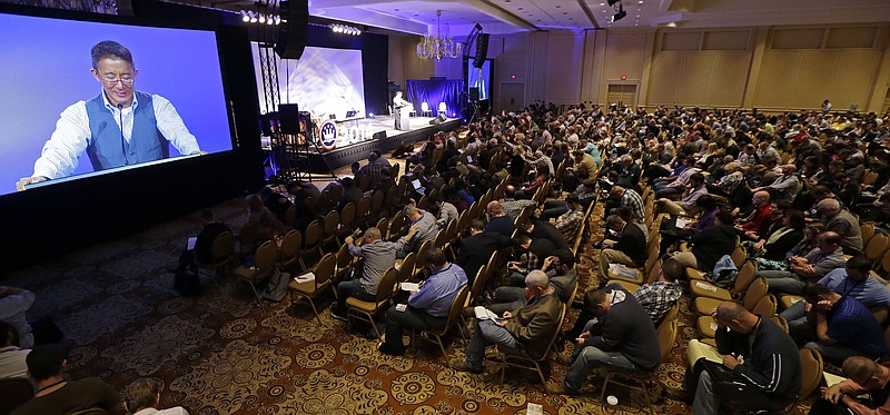 
              Christopher Yuan leads a prayer during the Ethics and Religious Liberty Commission National Conference, Tuesday, Oct. 28, 2014, in Nashville, Tenn. Southern Baptists organized the three-day event to strengthen the resolve of Christians preaching the increasingly unpopular view that gay relationships are sinful. (AP Photo/Mark Humphrey)
            