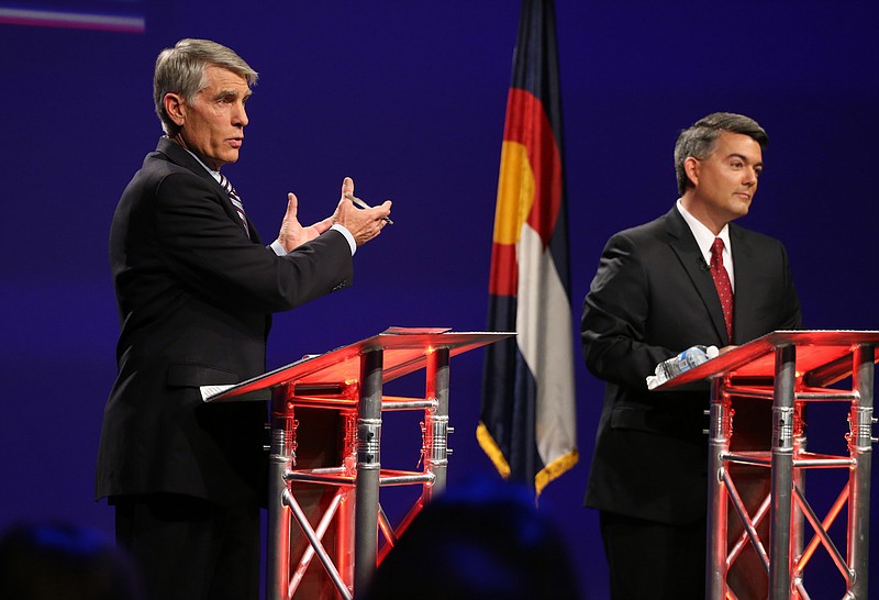 
              FILE - In this Oct. 15, 2014 file photo, Sen. Mark Udall, D-Colo., left, and his Republican opponent, Rep. Cory Gardner, R-Colo., face off during a televised debate at 9News in Denver. As a season of campaigning enters its final, intense weekend, a new Associated Press-GfK poll illustrates the challenge ahead for candidates and their allies trying to rally voters around traditional wedge issues such as abortion and gay marriage. This fall, voters just have other matters on their minds. (AP Photo/Brennan Linsley, File)
            