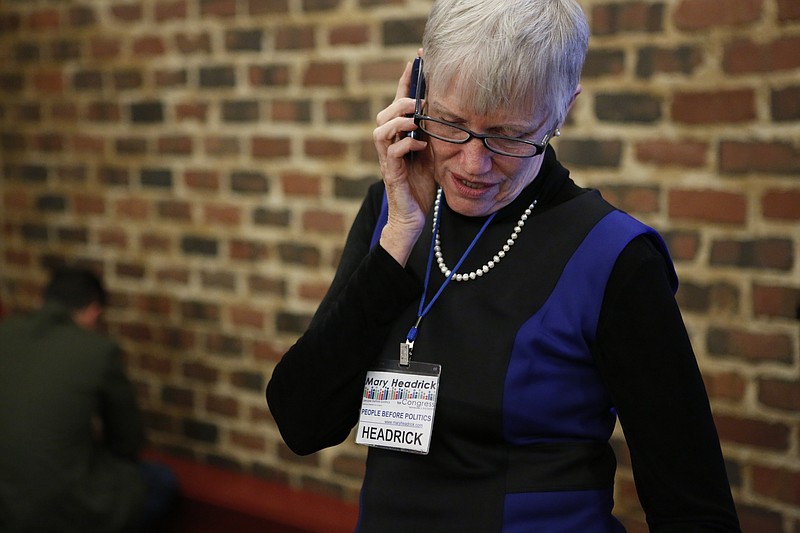 Democratic Tennessee 3rd Congressional District race candidate Dr. Mary Headrick calls Chuck Fleischmann to concede Tuesday, Nov. 4, 2014, during her election returns party at the Chattanooga Choo Choo in Chattanooga, Tenn.