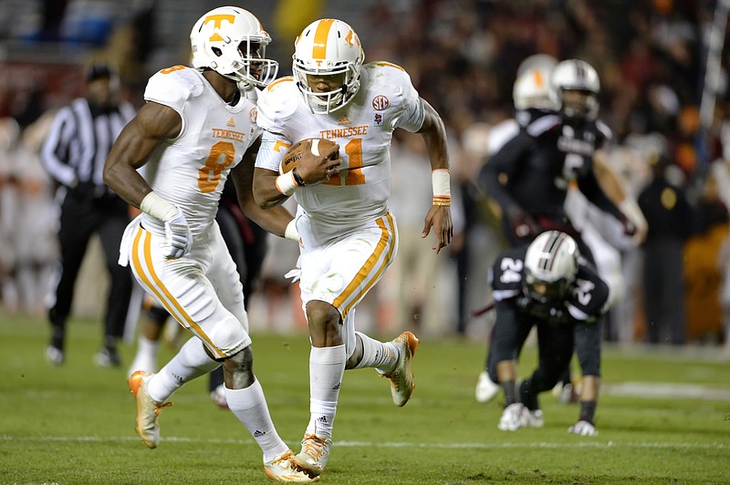 Tennessee quarterback Joshua Dobbs (11) takes off on a fourth-down play, with seconds left on the clock, to score a 36-yard touchdown at South Carolina last Saturday.