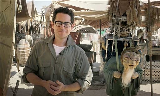 In this video grab made available by Lucasfilm Ltd. & TM on Thursday, May 22, 2014, J.J. Abrams, director of "Star Wars: Episode VII," talks to the fans from the movie set in the desert in Abu Dhabi, United Arab Emirates.