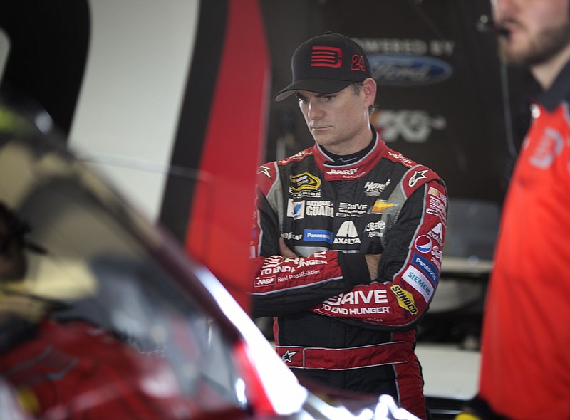 
              NASCAR driver Jeff Gordon waits in his garage as he prepares for a Sprint Cup Series Ford EcoBoost 400 auto race practice session, Friday, Nov. 14, 2014, in Homestead, Fla. (AP Photo/J Pat Carter)
            