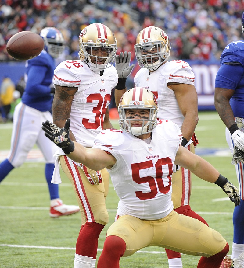 
              San Francisco 49ers inside linebacker Chris Borland (50) celebrates after intercepting a pass during the first half of an NFL football game against the New York Giants, Sunday, Nov. 16, 2014, in East Rutherford, N.J. (AP Photo/Bill Kostroun)
            