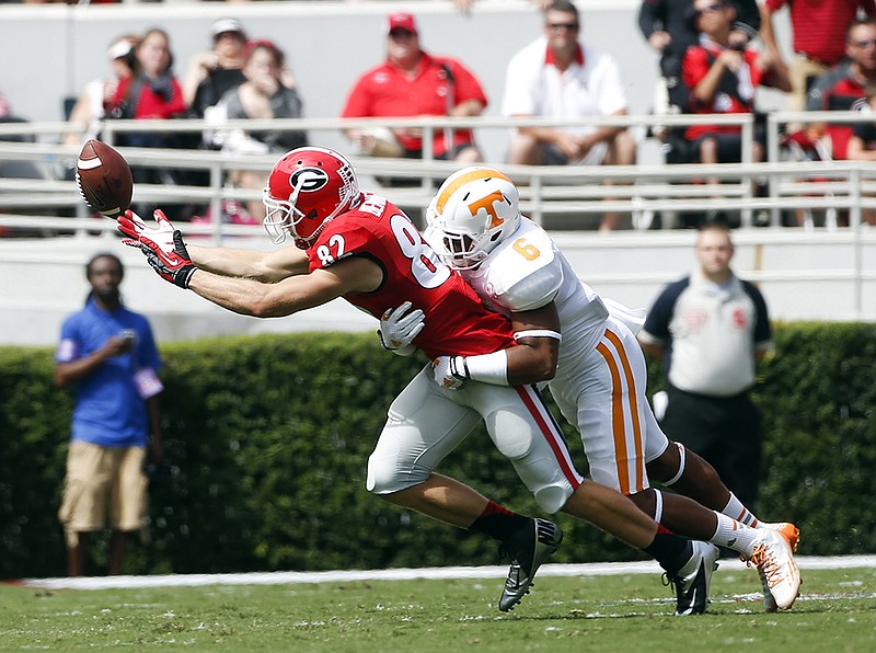 Georgia wide receiver Michael Bennett (82) can't reach a pass as Tennessee defensive back Todd Kelly Jr. (6) defends during the first half of an NCAA college football game on Saturday, Sept. 27, 2014, in Athens, Ga.