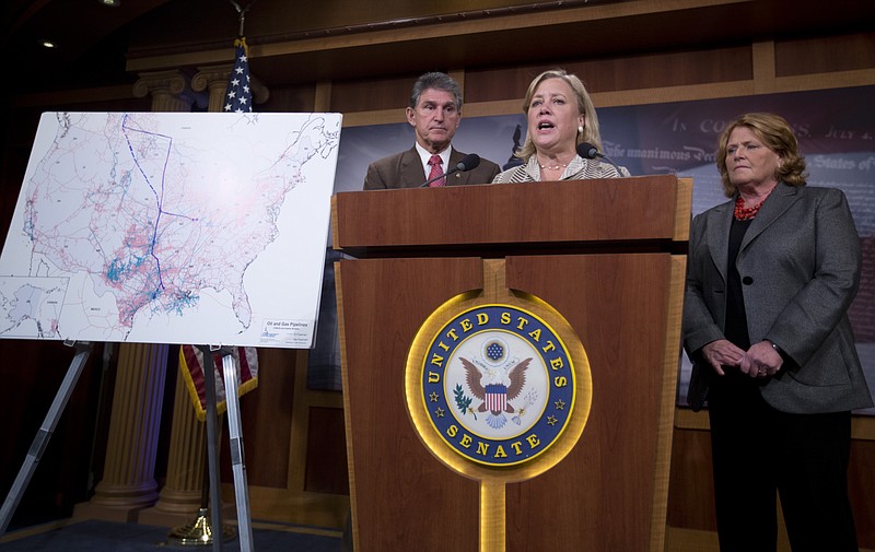 
              Sen. Mary Landrieu, D-La., chair of the Senate Energy and Natural Resources Committee, and the Keystone XL oil pipeline bill sponsor, joined by Sen. Joe Manchin, D-W. Va., , left, and Sen. Heidi Heitkamp, D-N.D., right, speaks during a news conference on Capitol Hill in Washington, Tuesday, Nov. 18, 2014. The U.S. Senate has rejected a proposal to fast-track the approval of the controversial Keystone XL pipeline. (AP Photo/Carolyn Kaster)
            