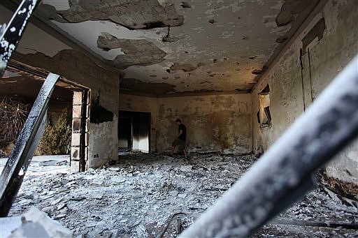 A Libyan man walks in the rubble of the damaged U.S. consulate, after an attack that killed four Americans in Benghazi, Libya, in this 2012 file photo.