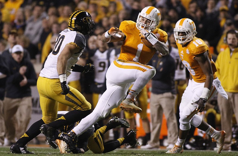 Tennessee running back Jalen Hurd breaks through a group of Missouri defenders during the Vols' football game against the Missouri Tigers on Saturday, Nov. 22, 2014, at Neyland Stadium in Knoxville.