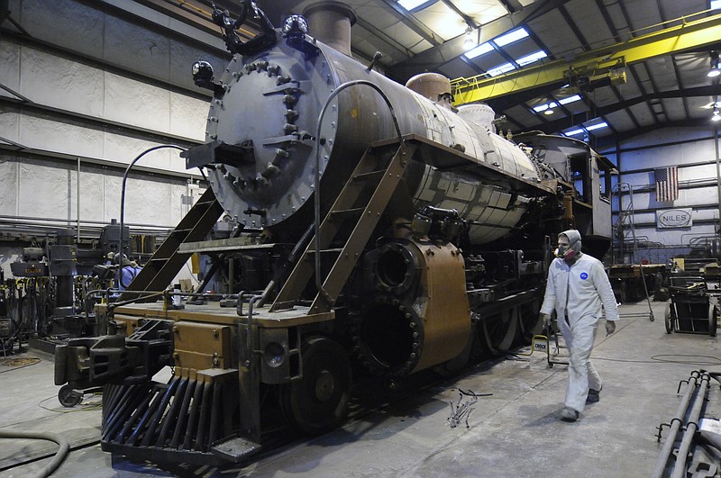David Pugh works on a steam-powered locomotive at the Tennessee Valley Railroad shop in 2010.