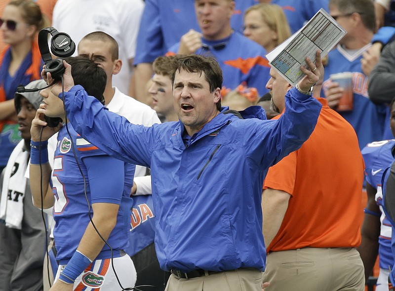 
              Florida head coach Will Muschamp waves his arms after disputing a call by officials during the first half of an NCAA college football game against Eastern Kentucky in Gainesville, Fla., Saturday, Nov. 22, 2014. (AP Photo/John Raoux)
            