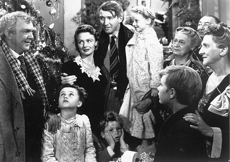 In this 1946 file photo originally provided by RKO Pictures Inc., legendary actor James Stewart as George Bailey, center, is reunited with his wife played by actress Donna Reed, third from left, and family during the last scene of Frank Capra's "It's A Wonderful Life." (File photo/The Associated Press)