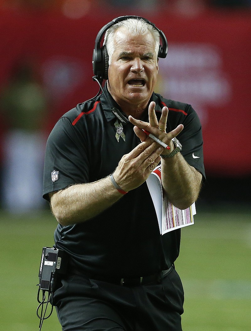 
              Atlanta Falcons head coach Mike Smith tries to call a time out during the first half of an NFL football game against the Cleveland Browns, Sunday, Nov. 23, 2014, in Atlanta. (AP Photo/John Bazemore)
            