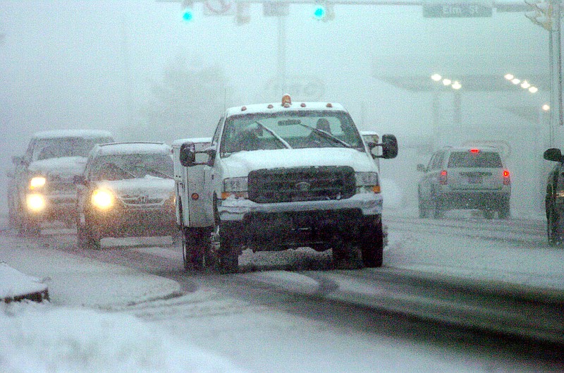 
              File-This Oct 29, 2011, file photo shows vehicles travelling slowly in near white out conditions along State Route 309 in Mountaintop, Pa.,  A nor'easter was expected to develop along the East Coast just as millions of travelers head to their Thanksgiving destinations, bringing mostly rain close to the coast, but heavier snow further inland. The exact track and severity of the storm had meteorologists on alert. (AP Photo/The Citizens' Voice, Mark Moran, File)
            