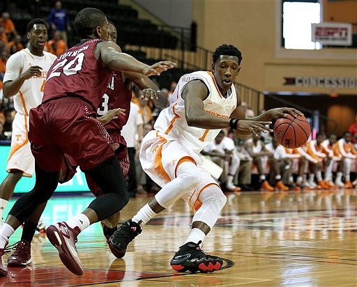 Tennessee guard Josh Richardson (1) drives to the hoop around Santa Clara guard Denzel Johnson (20) during their game in Lake Buena Vista, Fla., on Nov. 27, 2014.