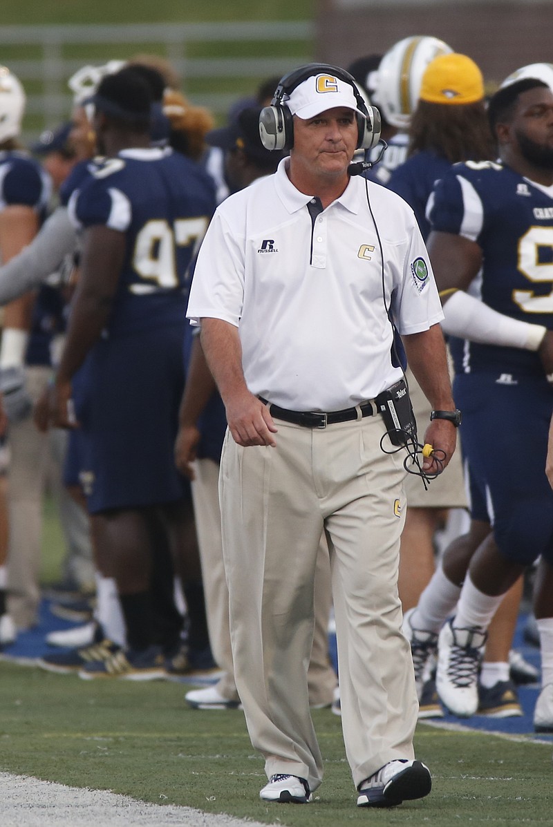 After six seasons as coach, Russ Huesman has led UTC to its first unbeaten conference record.