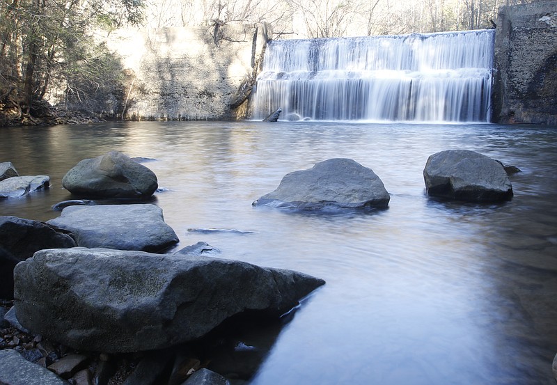 The falls over the dam at Rainbow Lake are seen on Friday, Nov. 28, 2014, in Signal Mountain, Tenn. The Land Trust for Tennessee is helping the town of Signal Mountain to permanently protect the 342-acre public park space.