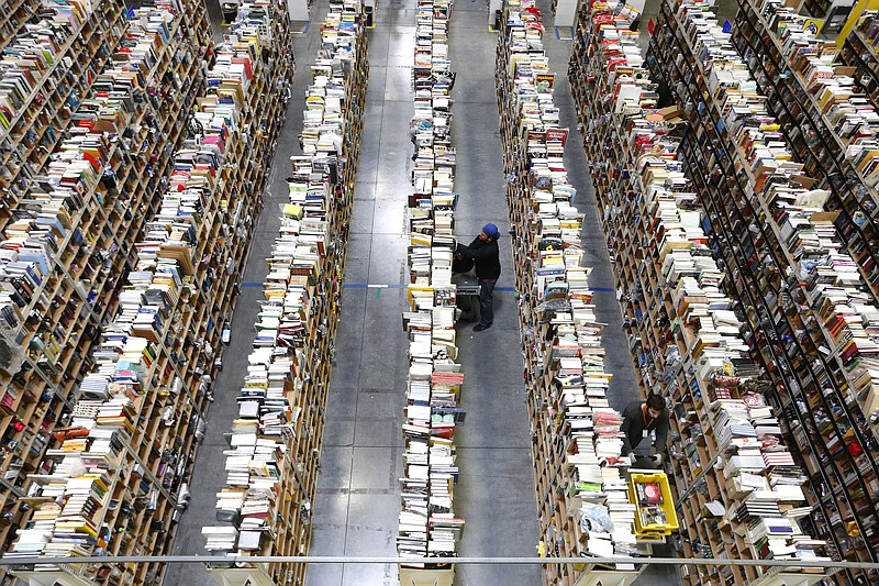 Amazon.com employees work the shelves along the miles of aisles at an Amazon.com Fulfillment Center on "Cyber Monday", the Monday after Thanksgiving and the busiest online shopping day of the holiday season, in this file photo.