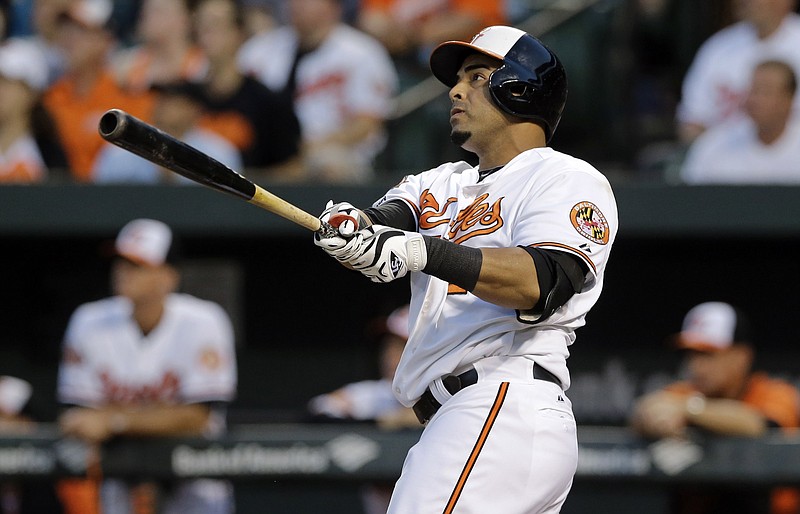 
              FILE - In this Sept. 4, 2014, file photo, Baltimore Orioles' Nelson Cruz watches his two-run home run in the first inning of an interleague baseball game against the Cincinnati Reds in Baltimore. Two people with knowledge of the deal say the Mariners and free agent slugger Nelson Cruz are nearing agreement on a contact that would give Seattle the right-handed bat it has sought.  The people spoke to The Associated Press on Monday, Dec. 1, 2014, on the condition of anonymity because the deal between Cruz and the Mariners had not been finalized and was pending a physical. (AP Photo/Patrick Semansky, File)
            
