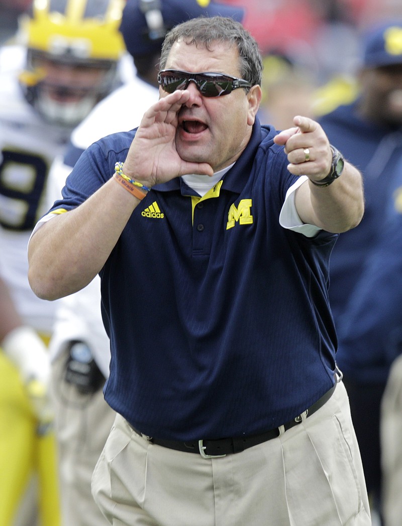 
              Michigan head coach Brady Hoke shouts to his team as they play against Ohio State in the third quarter of an NCAA college football game Saturday, Nov. 29, 2014, in Columbus, Ohio. Ohio State beat Michigan 42-28. (AP Photo/Jay LaPrete)
            