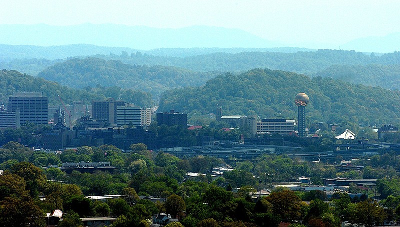 In this 2005 file photo, the Smoky Mountains are seen through the haze behind the skyline of downtown Knoxville, Tenn. (AP photo/Knoxville News Sentinel, Michael Patrick)