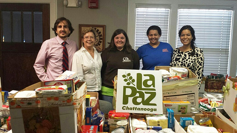 Chattanooga State faculty and students delivered 41 food boxes to La Paz Chattanooga. From left are Juan Santillana, instructor; Katheryn Thompson, associate professor; Spanish I students Abby Callahan and Misty Smith; and Vivian Lozano of La Paz.