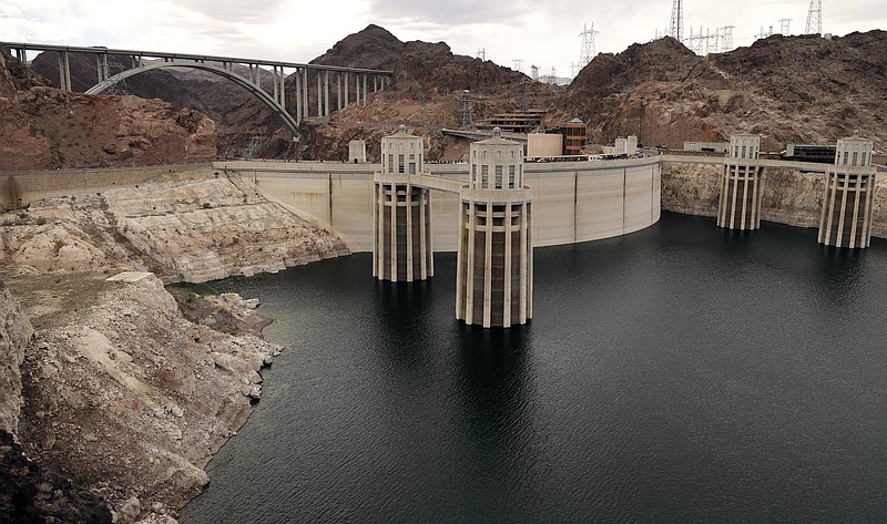 The high water mark for Lake Mead is visible on Hoover Dam and its spillway near Boulder City, Nev., in this 2013 file photo.