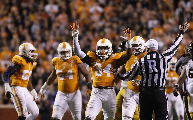 Tennessee linebacker Jalen Reeves-Maybin (34) raises his hands after stopping a run during the Vols' fgame against the Missouri Tigers.