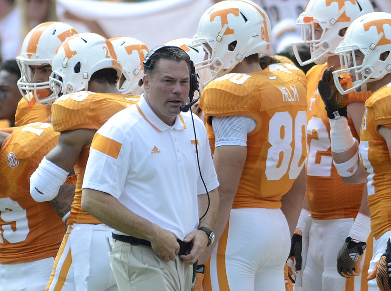 UT coach Butch Jones walks the sidelines during the game against Arkansas State at Neyland Stadium in this file photo.