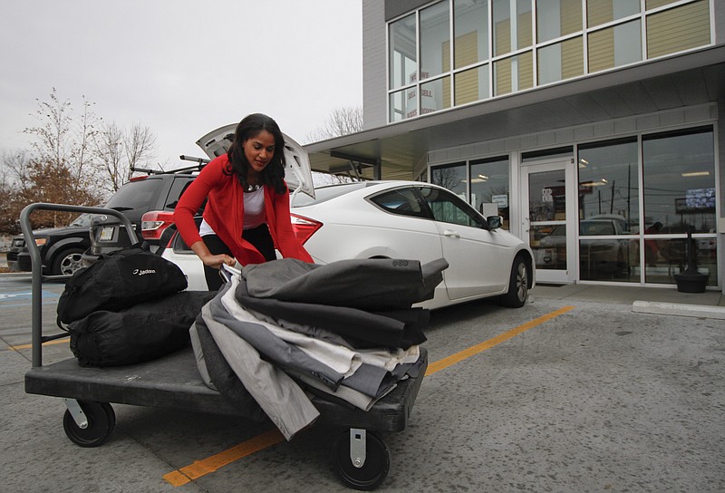 Miss Chattanooga Stephanie McKain, who knows what it’s like to grow up in need, drops off donations at a storage unit in preparation for a clothing giveaway she is organizing for the less fortunate.