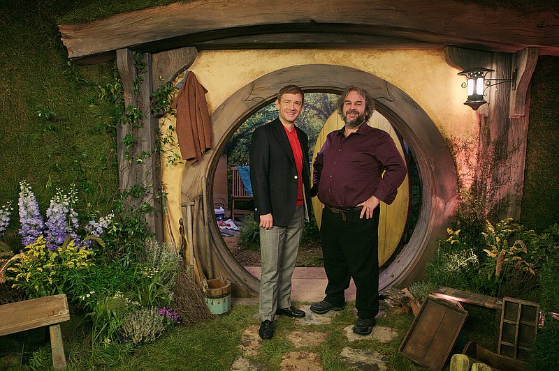 
              In this picture taken on Monday, Dec. 1, 2014. British actor Martin Freeman and director Peter Jackson from New Zealand poses for photographs in promotion for the film 'The Hobbit, Battle of the Five Armies' in the Claridges suite in west London.  After a long and eventful journey, "The Hobbit" trilogy has reached its bloody climax. Not a minute too soon for director Peter Jackson, who has been longing to unleash mayhem on Middle Earth. "It's the first time we've got to kill dwarves," said the director, his enthusiasm for death and destruction at odds with his laid-back manner and luxurious surroundings in a London hotel suite. "It's hard to get any emotional power in a film unless you are able to actually kill some of your main characters,” he said. “We've been hampered with that in the first two 'Hobbit' movies. But at least we have a good dwarf death toll in the third one." "The Hobbit: The Battle of the Five Armies" wraps up the trilogy spun from J.R.R. Tolkien's slim book about home-loving hobbit Bilbo Baggins, coaxed away from his burrow to help a band of dwarves retake their mountain home from a destructive dragon.(Photo by Joel Ryan/Invision/AP)
            