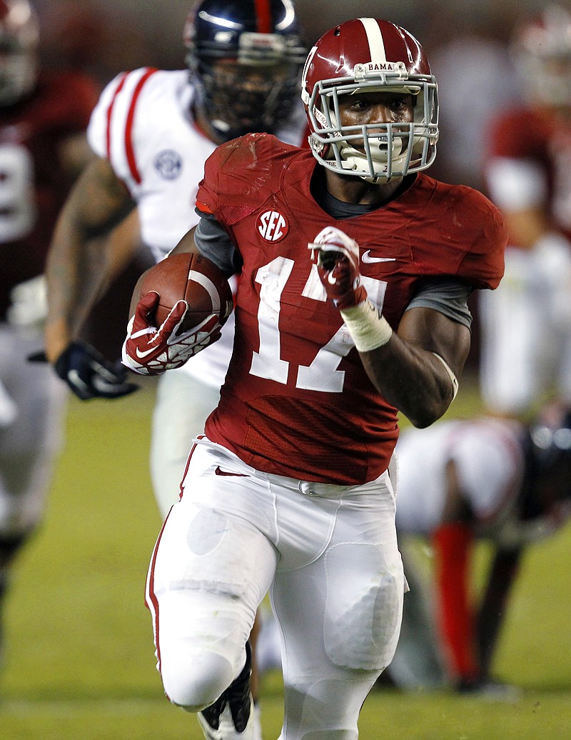 Alabama running back Kenyan Drake (17) breaks free for a 50-yard touchdown against Mississippi in this photo from September 2013 in Tuscaloosa, Ala.