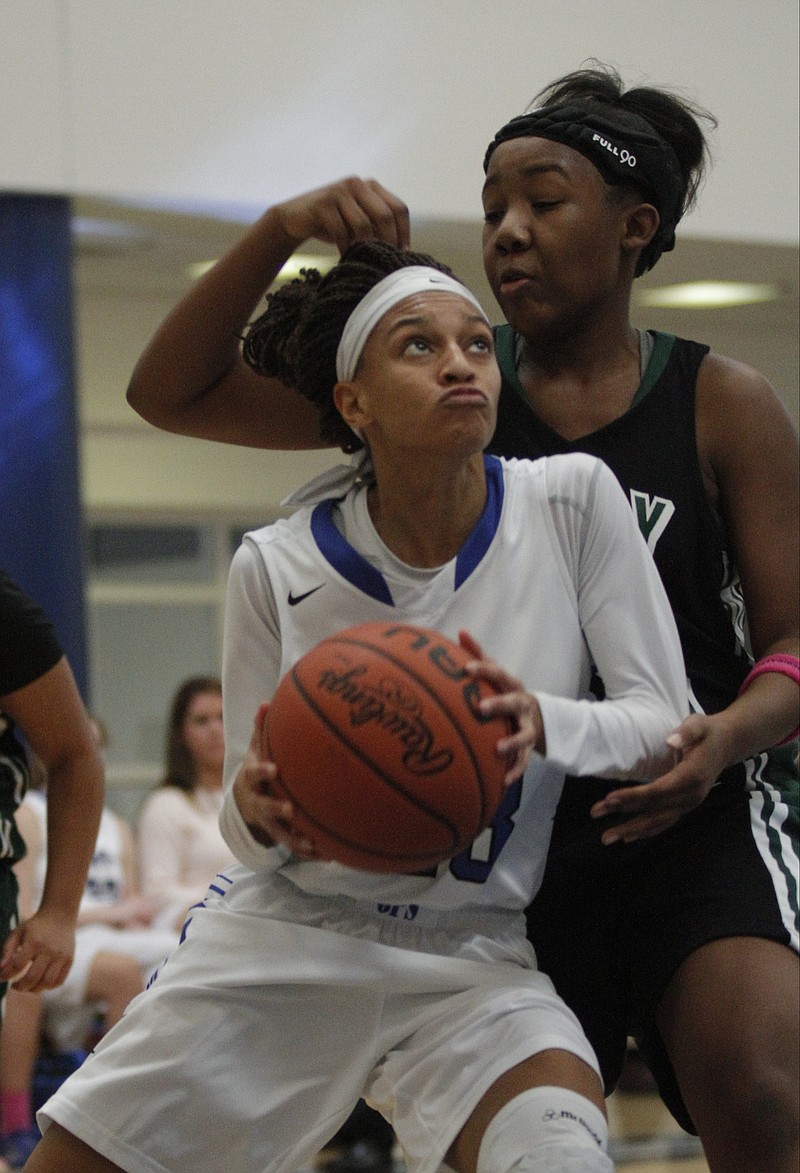 GPS's Akia Harris breaks around Notre Dame's Adia Colvin during their Hoops for Hope breast-cancer-awareness basketball game Saturday, Dec. 13, 2014, at Girls Preparatory School in Chattanooga, Tenn.