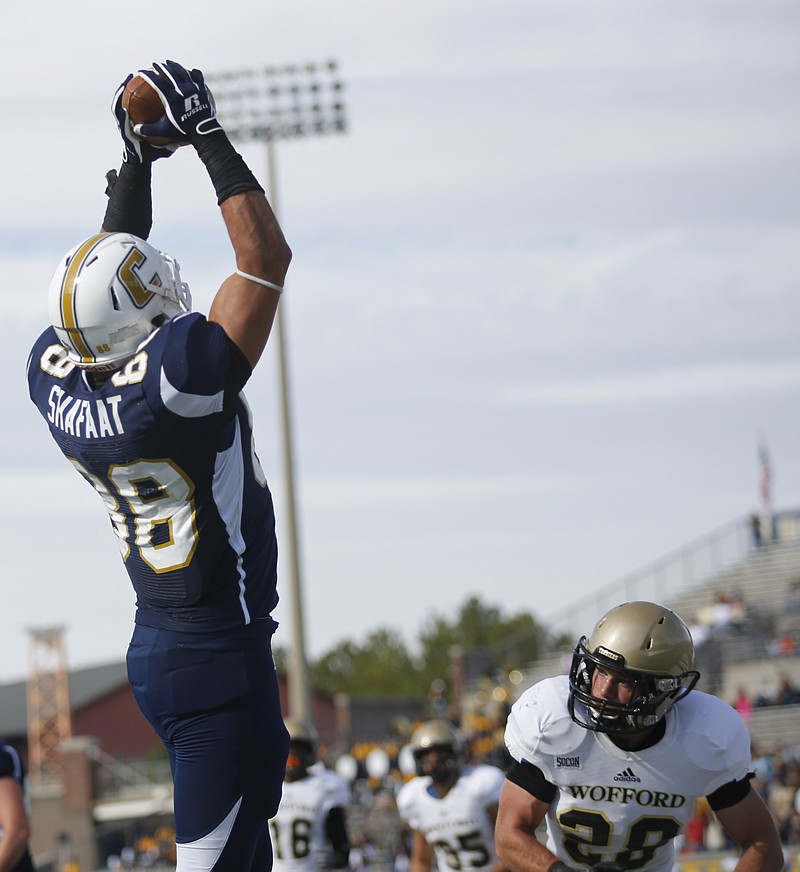 UTC tight end Faysal Shafaat catches a pass in the end zone for a touchdown ahead of Wofford safety Zack Cole during the Mocs' 31-13 win over the Wofford Terriers on Nov. 8, 2014 at Finley Stadium. The win netted the Mocs the SoCon championship and a spot in the playoffs.