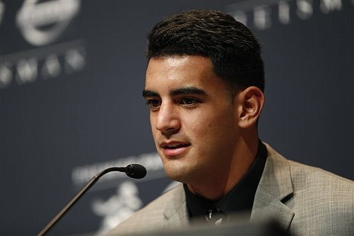 Oregon quarterback Marcus Mariota talks during a news conference prior to the announcement of the Heisman Trophy winner, Saturday, Dec. 13, 2014, in New York.