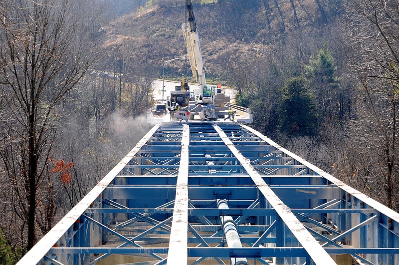 Bare steel is visible on the ridge cut bridge directly above Main Street in this view from South Crest Road at Interstate 24 on Thursday. Work continues to remove all the concrete for resurfacing.