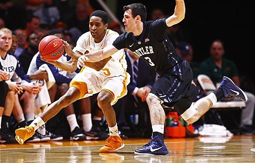 Butler guard Alex Barlow (3) attempts too steal the ball from Tennessee guard Detrick Mostella (15) in their game Sunday, Dec. 14, 2014, in Knoxville.