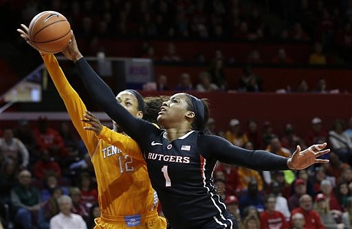 Rutgers' Rachel Hollivay (1) blocks s a shot by Tennessee's Bashaara Graves (12) during their game Sunday, Dec. 14, 2014, in Piscataway, N.J.