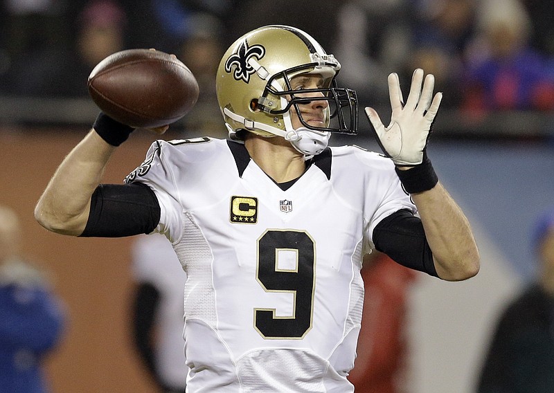 
              New Orleans Saints quarterback Drew Brees (9) throws a pass during the first half of an NFL football game against the Chicago Bears Monday, Dec. 15, 2014, in Chicago. (AP Photo/Nam Y. Huh)
            