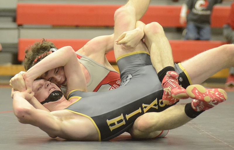 Joshua Brooks of Ooltewah controls Parker Ward of Hixson, foreground, in the 152-pound division as Ooltewah hosts Hixson in a high school wrestling match Tuesday, Dec. 16, 2014, in Chattanooga, Tenn. Brooks won by a pin, but Hixson won the match by a team score of 42-32. 